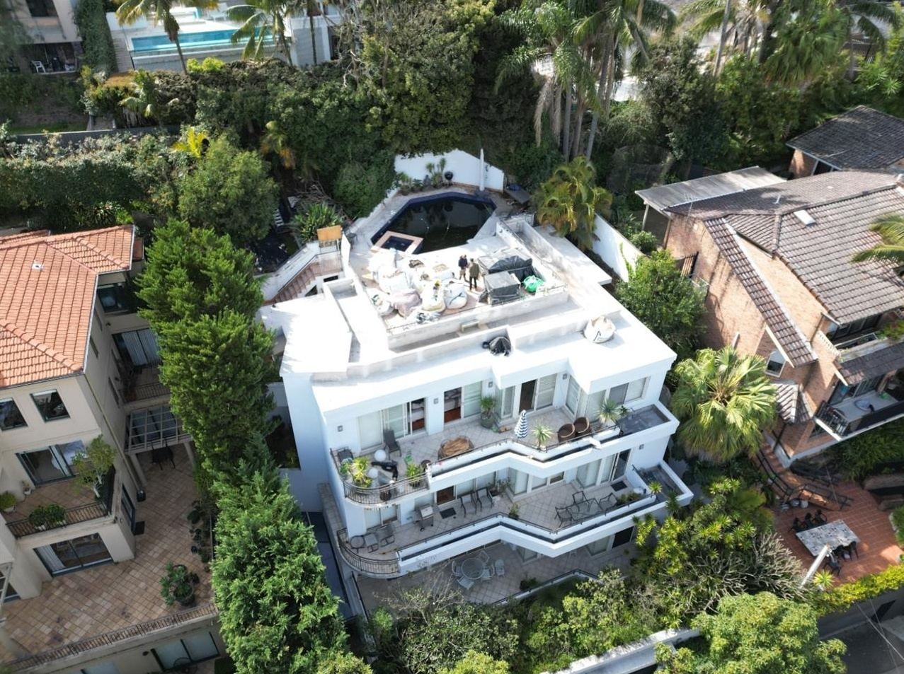 Aerial view of 8 Carlotta Road, Double Bay, a five-storey apartment building with a rooftop pool